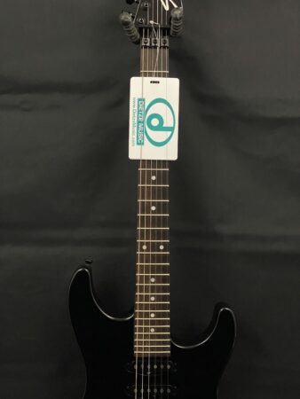 a guitar with a sign on it