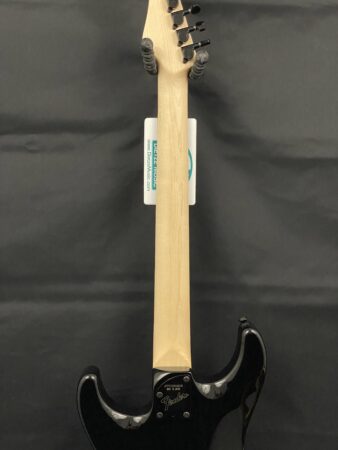 a wooden guitar with a strap