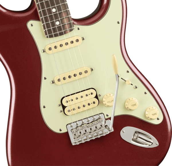 a guitar with a white and brown neck